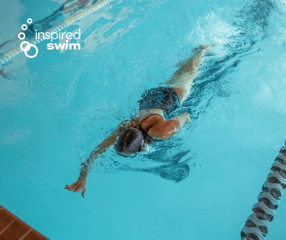 private swim lesson taking place with student swimming laps